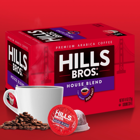 A box of Hills Bros House Blend Premium Arabica Coffee, featuring a cup of coffee, coffee beans, and a single-serve pod in front of a red background with a silhouette of a bridge.
